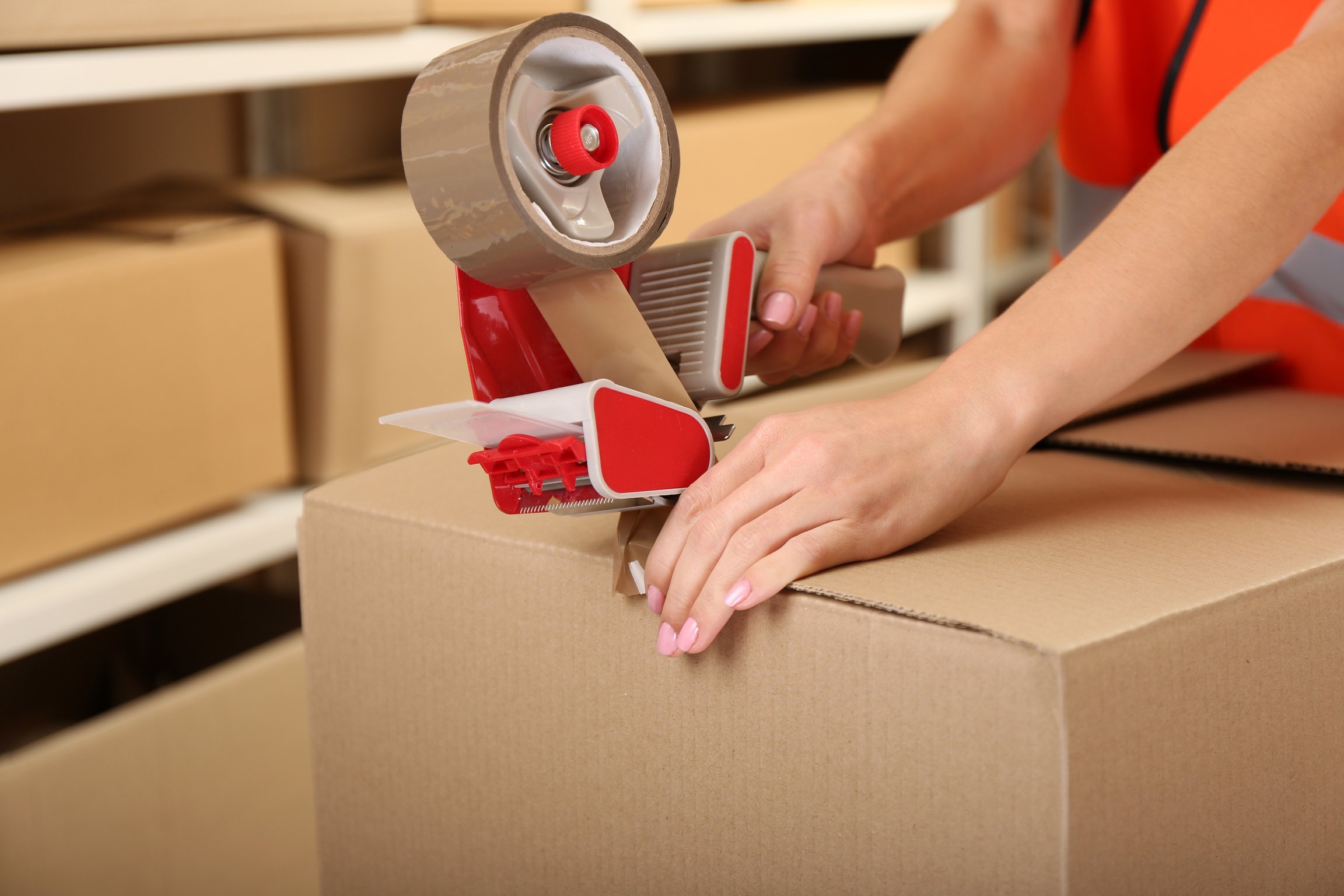 Person Packing Box at Warehouse